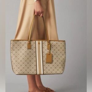 Sold***T Monogram Coated Canvas Tote. Brown